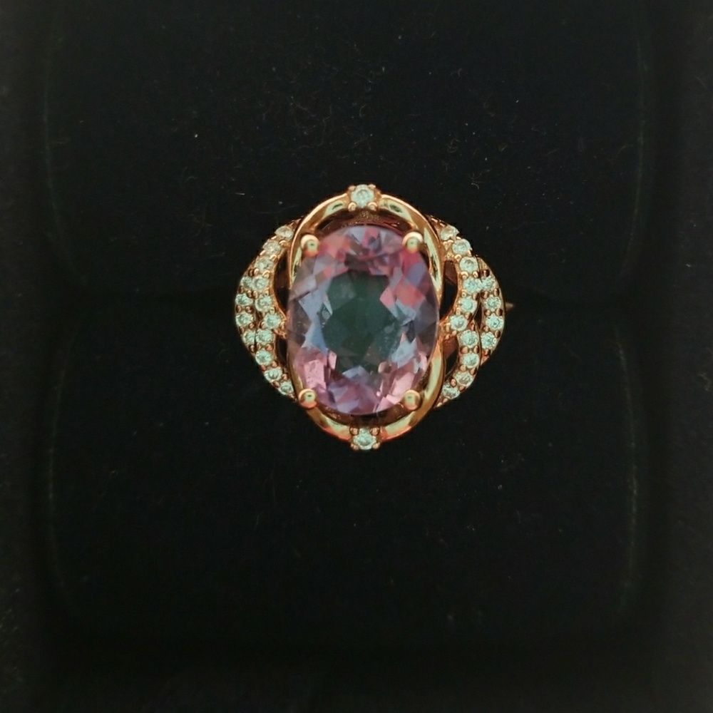 A rose gold ring with an amethyst stone